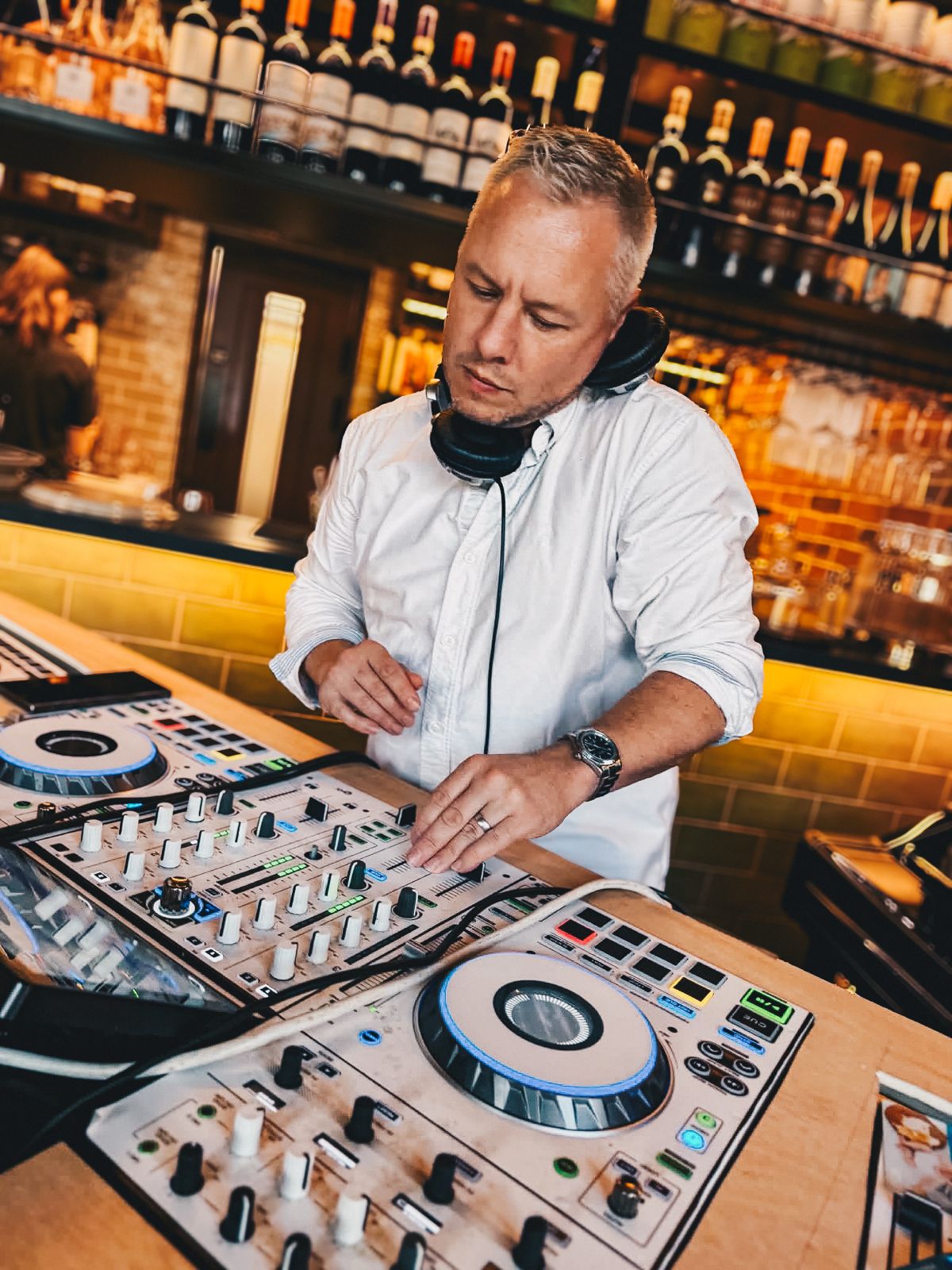 DJ Prestige performing behind the decks