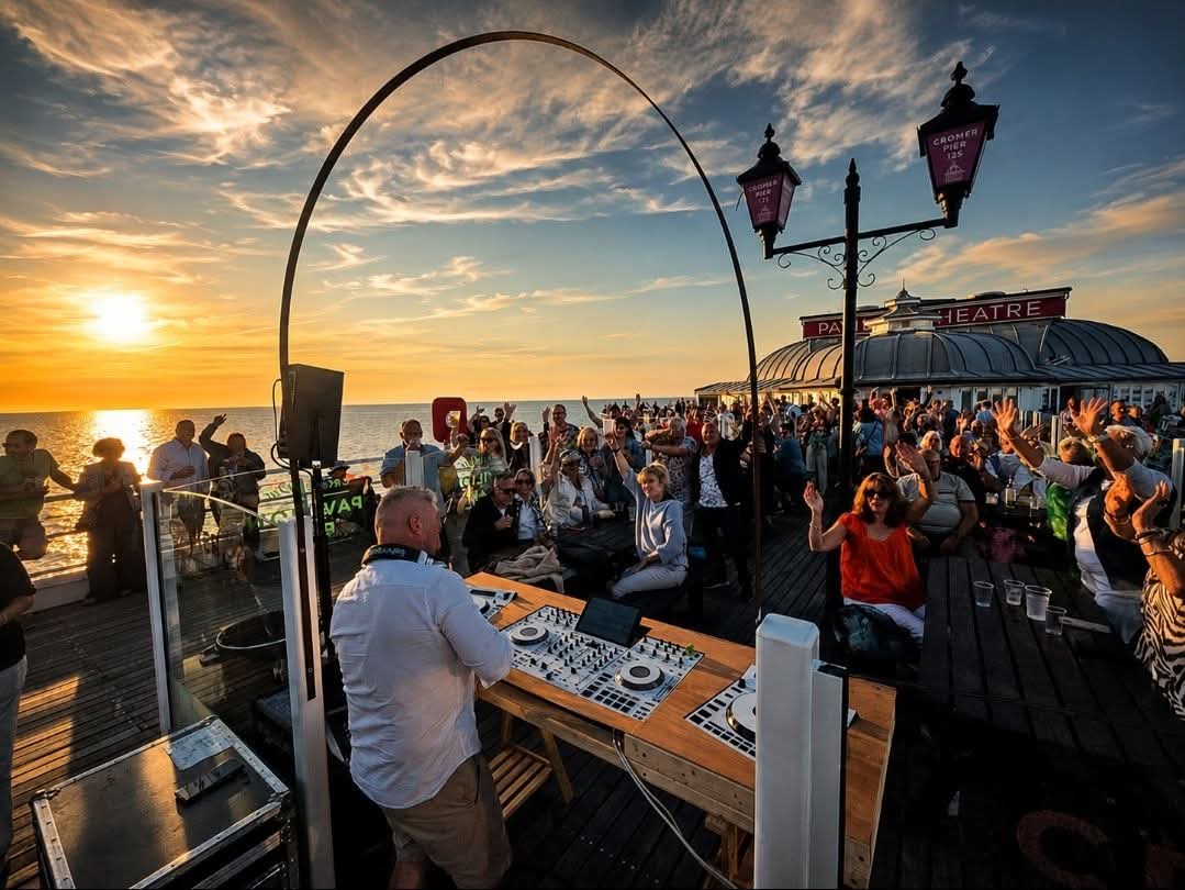 DJ Prestige playing at Cromer Pier sunset